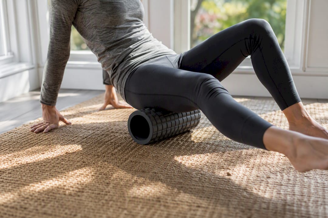 Foam rolling outer thigh for IT band