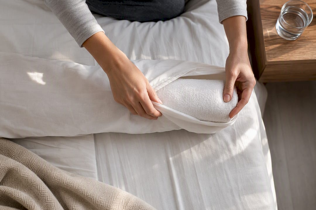 Rolled towel inside pillowcase for neck support